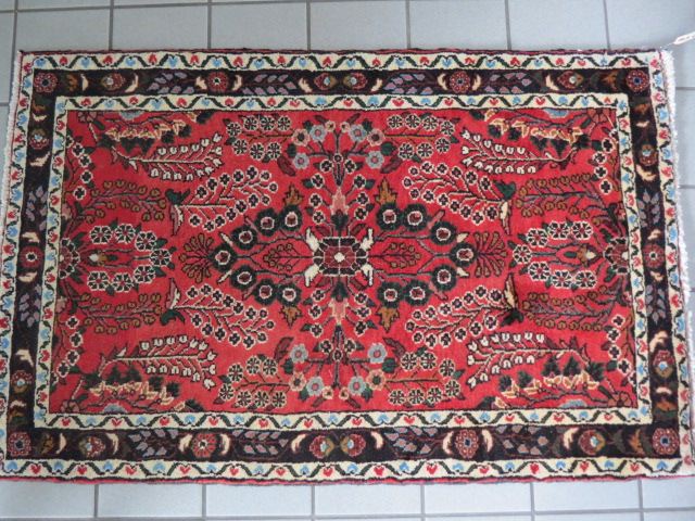 Appraisal: Heriz Persian Handmade Rug elaborate florals red field ' x