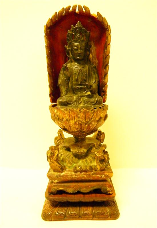 Appraisal: Guan Yin cast brass seated th th C figure in