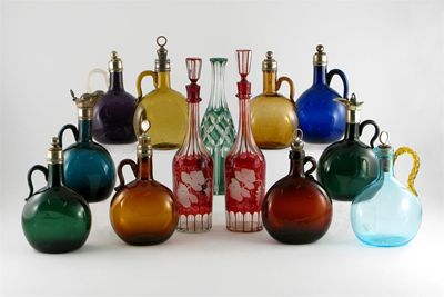 Appraisal: Ten coloured glass flasks with applied handles most with metal