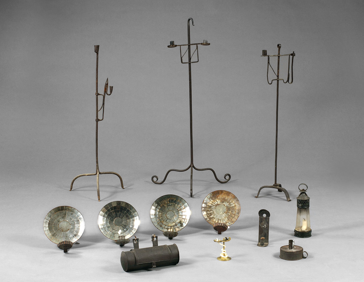 Appraisal: FOUR SMALL MIRROR-BACK SCONCES Each with candle cup Diameter approximately