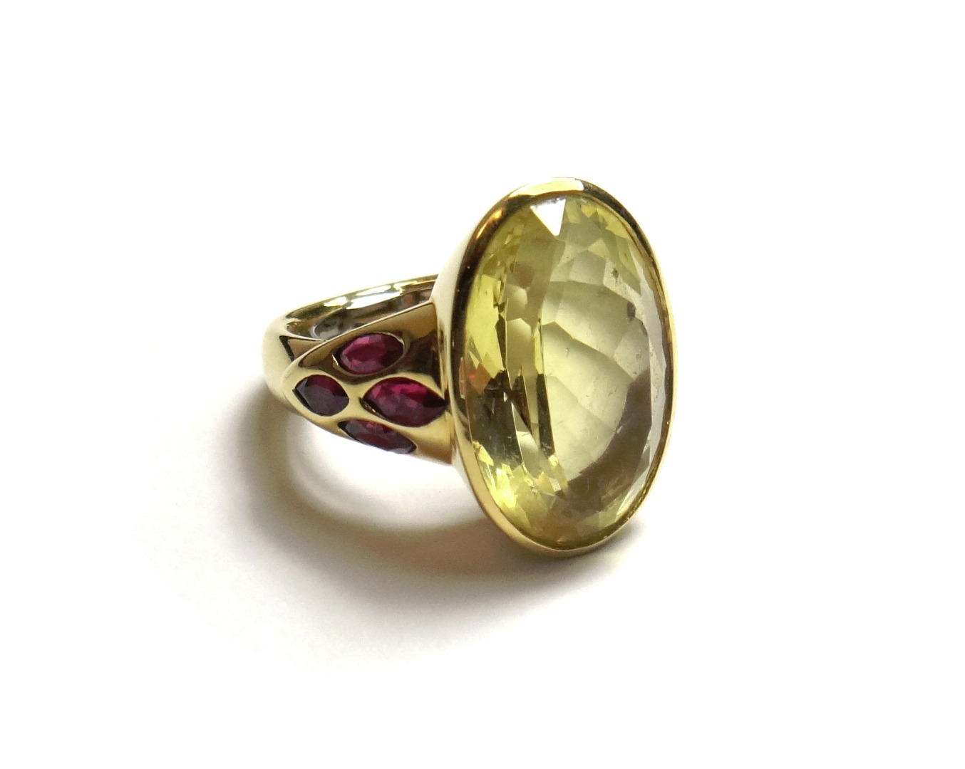 Appraisal: A gold citrine and garnet set ring collet set with