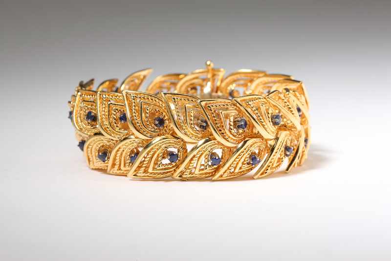 Appraisal: A gold and sapphire foliate bracelet K gold with sapphire