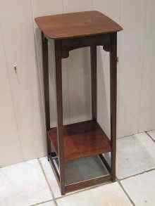 Appraisal: An Edwardian mahogany plant stand with undertier cm square x