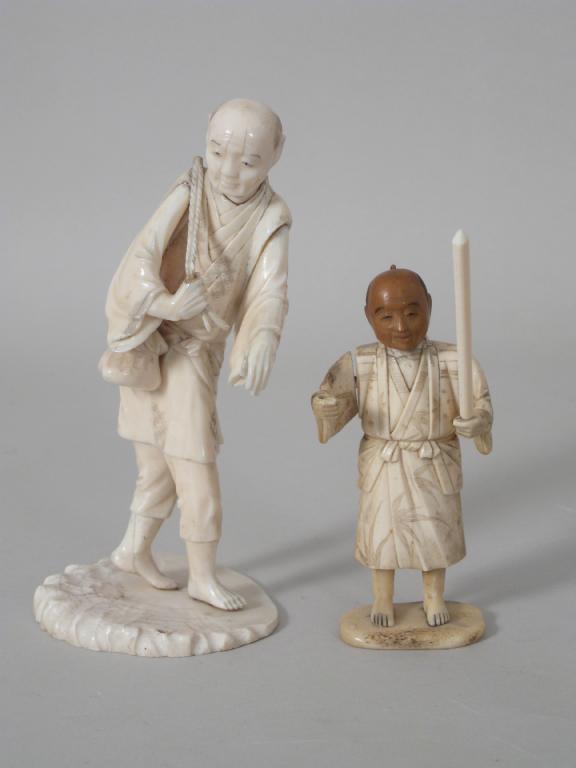 Appraisal: Japanese ivory standing figure Man with basket and staff on