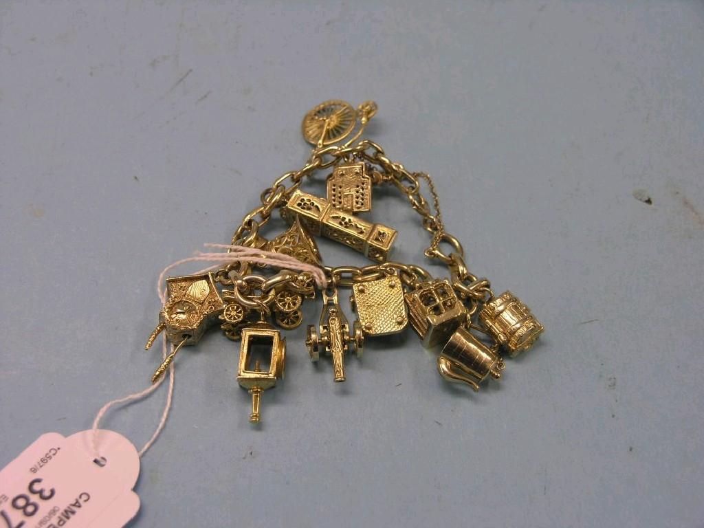 Appraisal: A ct gold charm bracelet twelve ct gold charms grams