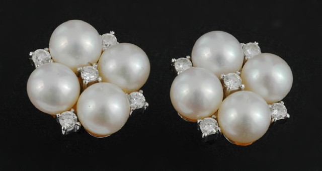 Appraisal: A pair of cultured pearl and diamond earrings Each earring