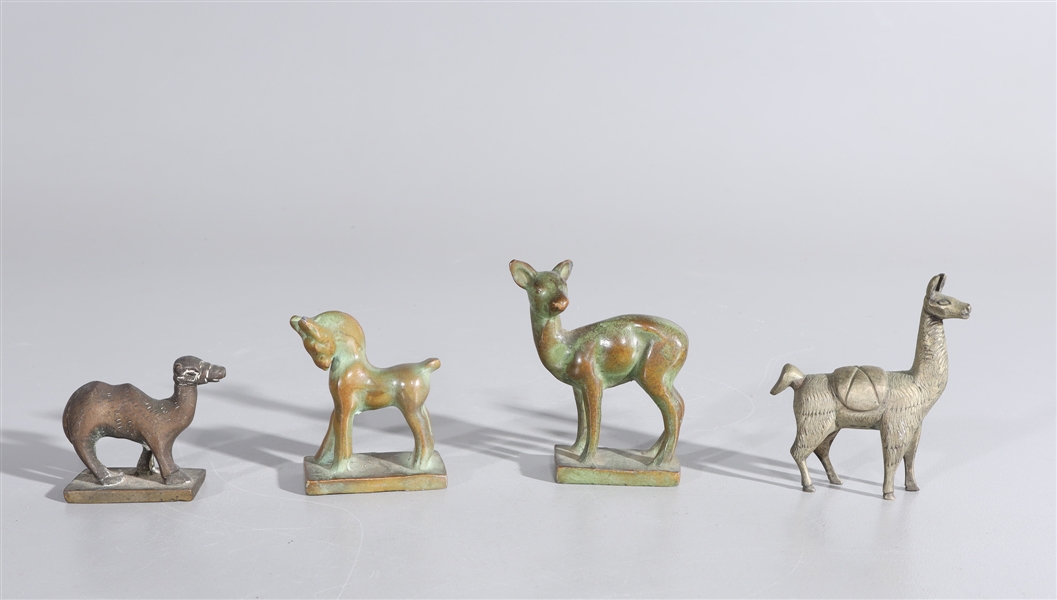 Appraisal: Four antique bronze animals including deer lama horse and camel