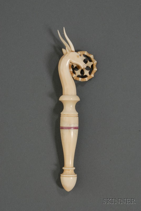 Appraisal: Carved Ivory Jagging Wheel one end carved with the head