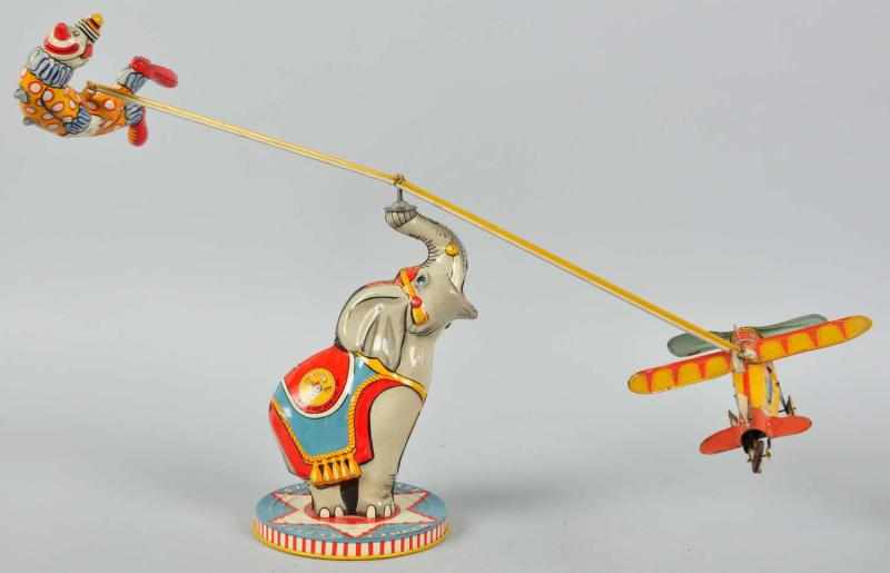 Appraisal: Tin Litho Unique Art Flying Circus Wind-Up Toy Description American