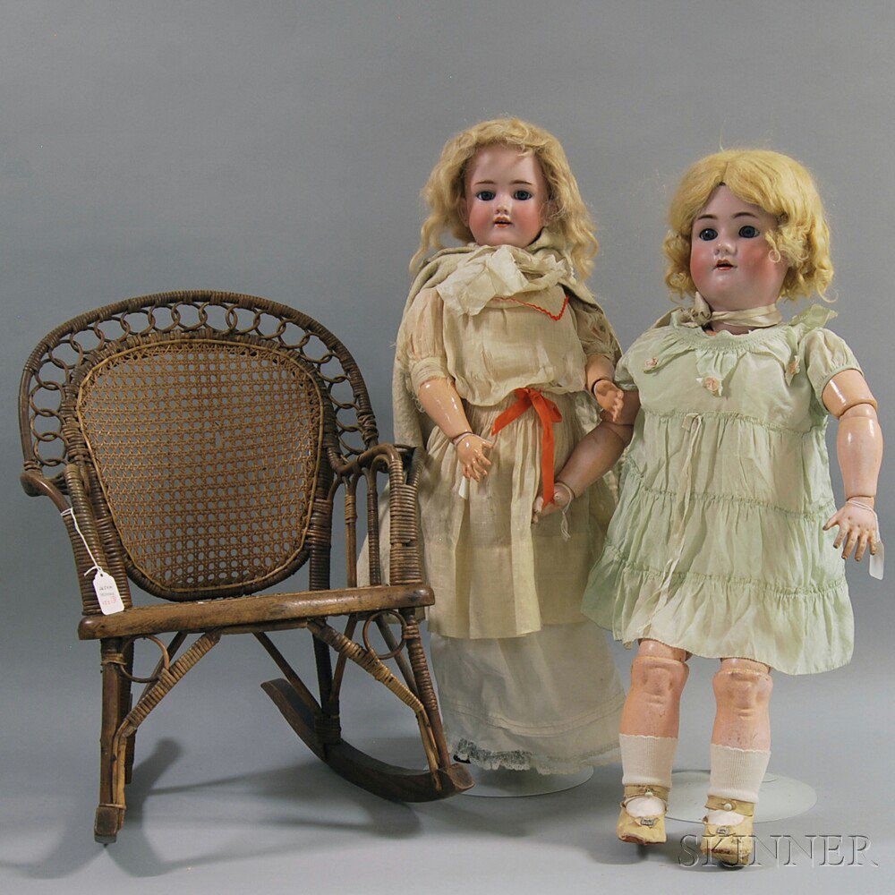 Appraisal: Two Large Handwerck Halbig Bisque Head Dolls and a Chair