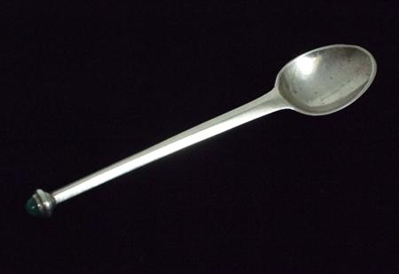 Appraisal: GUILD OF HANDICRAFTS TEASPOON DATED silver the facetted tapered stem