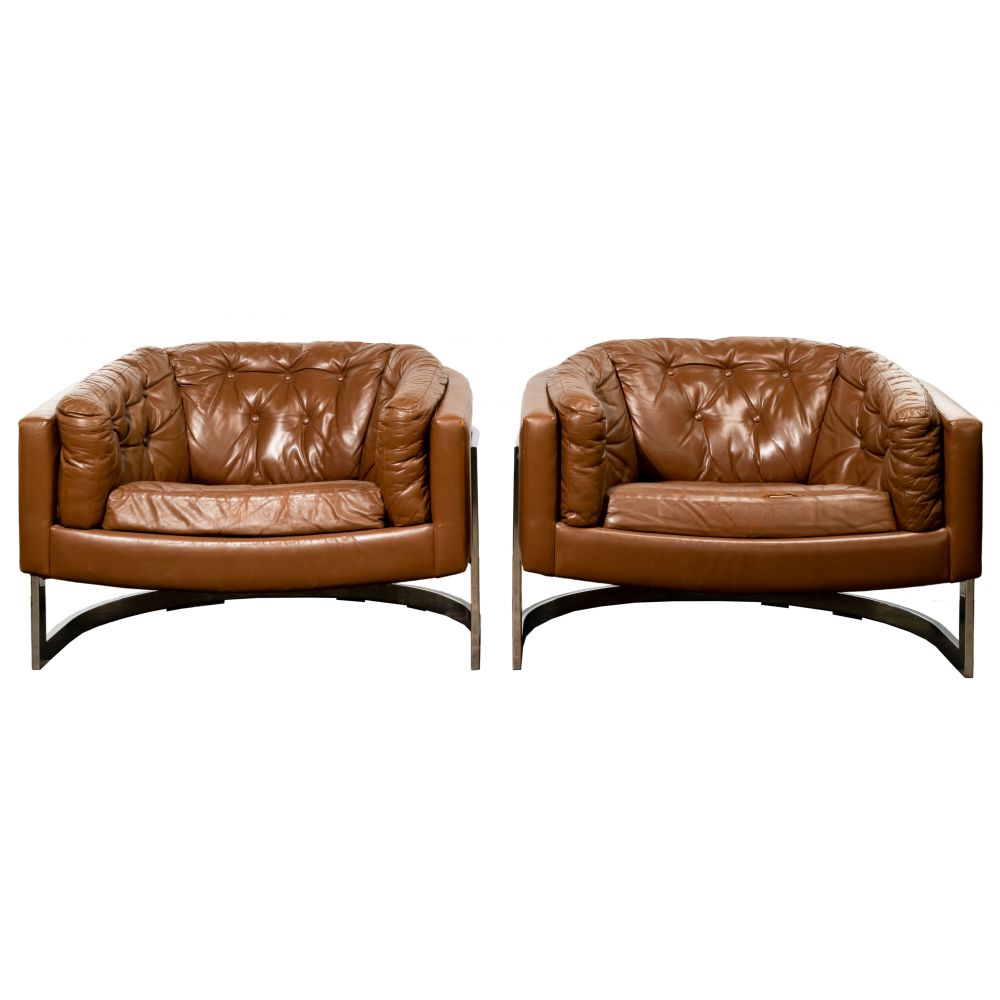 Appraisal: LEATHER AND CHROME BARREL CHAIRSPair having tufted brown leather on