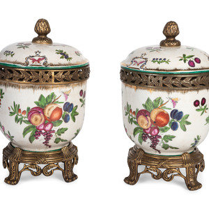 Appraisal: A Pair of United Wilson Gilt Metal Mounted Porcelain Urns