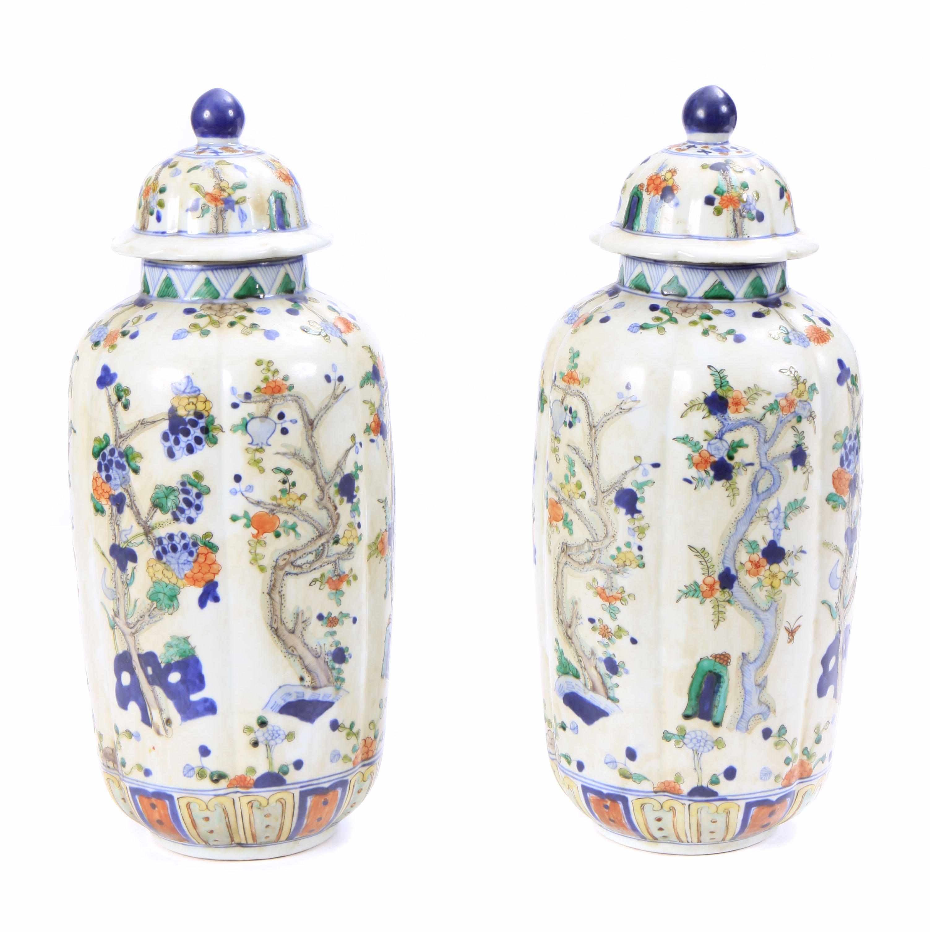 Appraisal: A pair of Chinese polychrome decorated covered vases height in