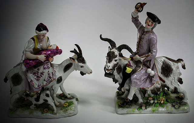 Appraisal: A PAIR OF TH CENTURY CONTINENTAL PORCELAIN FIGURE GROUPS depicting