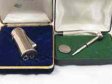 Appraisal: A silver propelling pencil in the form of a golf