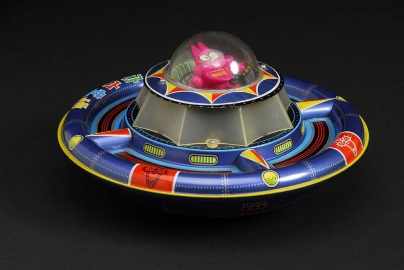 Appraisal: Flying Saucer with Cat Toy Description Japanese Made by Nomura