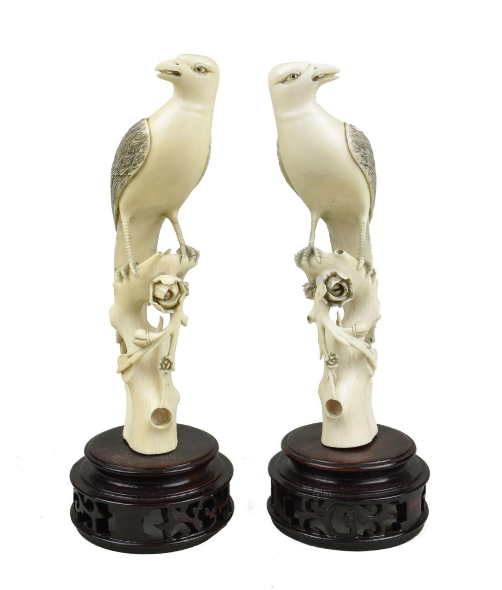 Appraisal: PAIR OF CHINESE FIGURAL GROUP OF A HAWK ATOP A