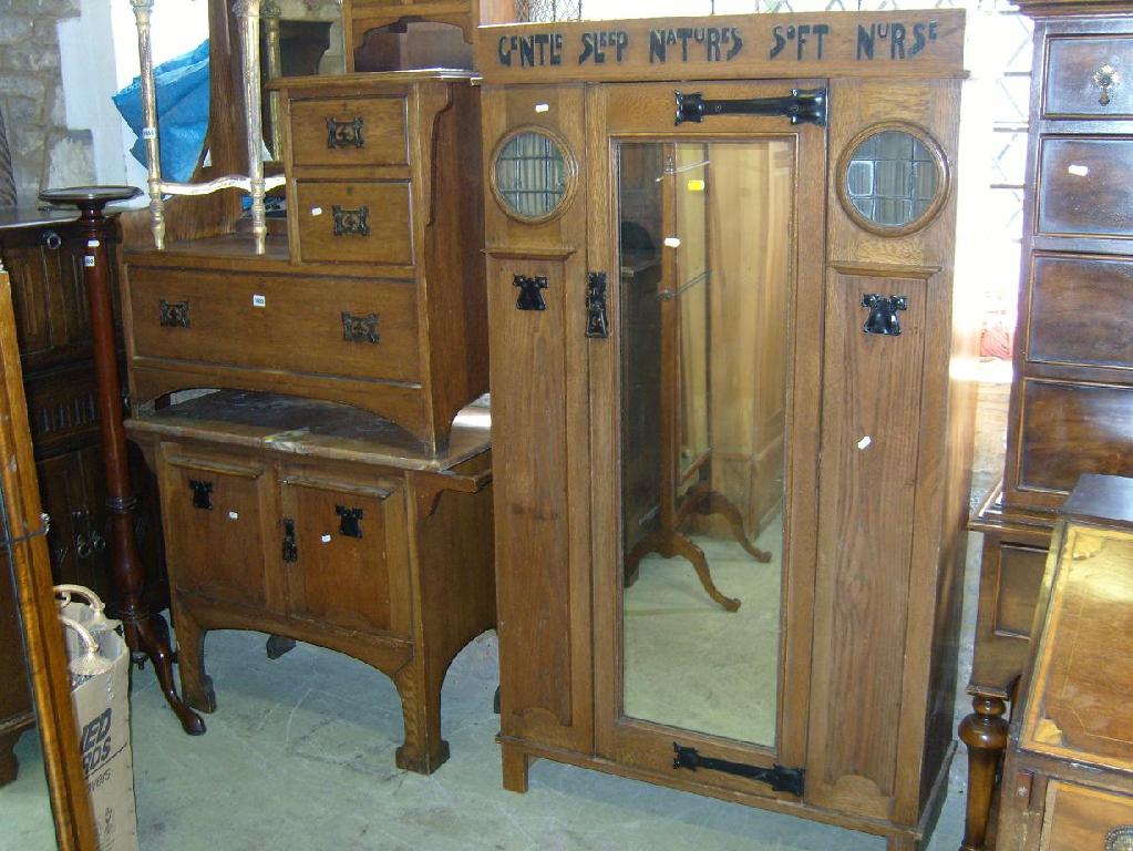 Appraisal: An oak bedroom suite comprising wardrobe marble top washstand and