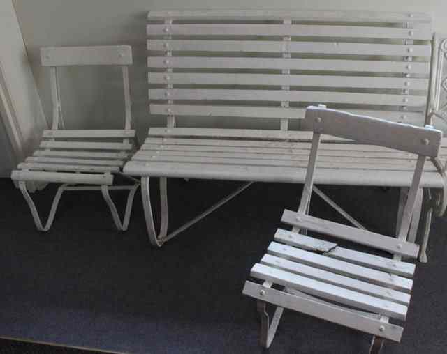 Appraisal: A wooden slatted garden seat and two matching chairs