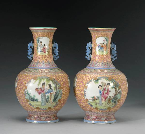 Appraisal: A pair of yellow ground porcelain vases with famille rose