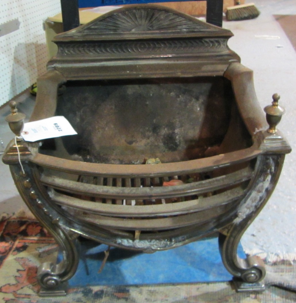 Appraisal: A Victorian style cast iron fire basket with brass urn