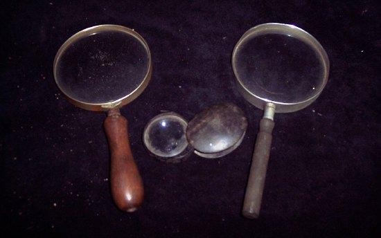 Appraisal: A folding magnifying glass of oval shape and two further