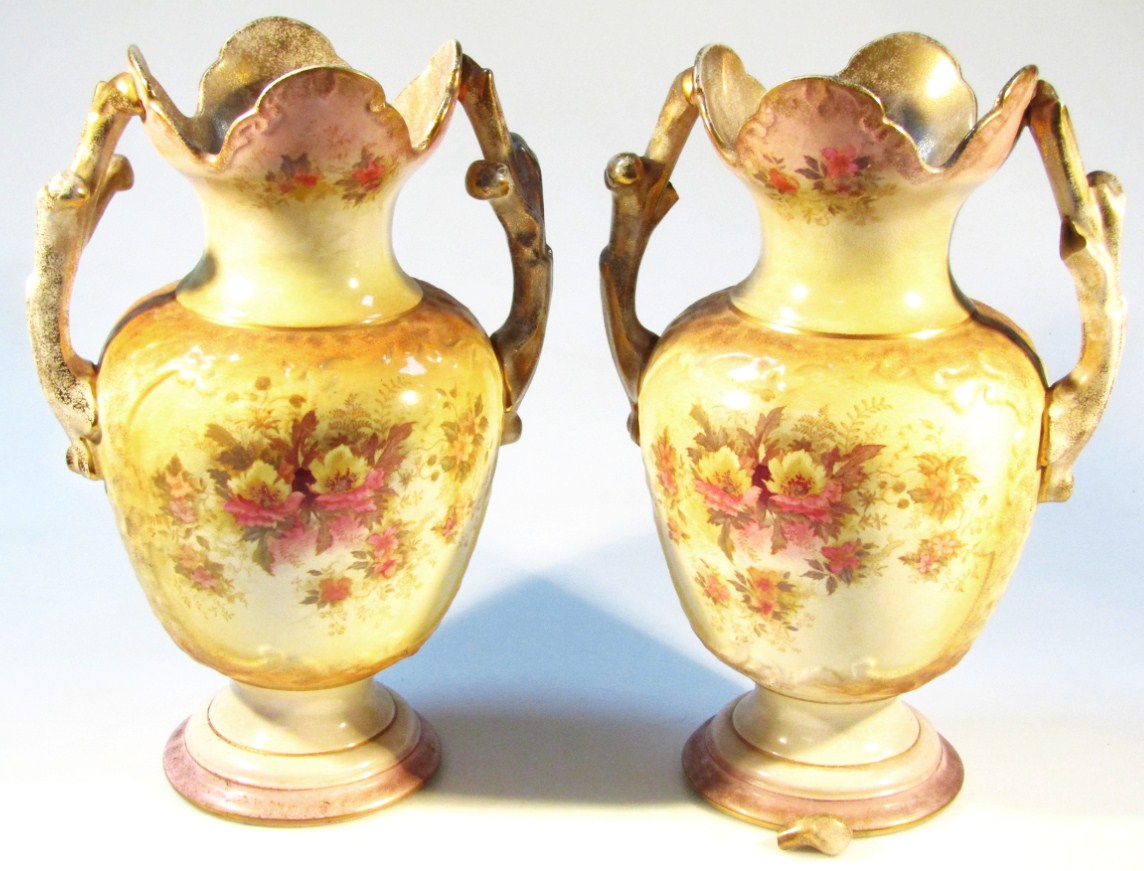 Appraisal: A pair of Edwardian Valkyrie Humphries Tunstall vases each with