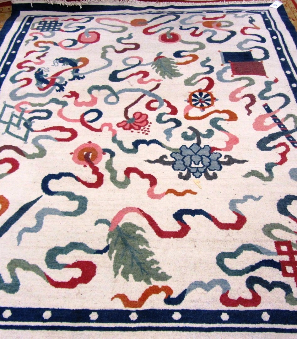 Appraisal: A Chinese carpet the ivory field with bold ribbons various