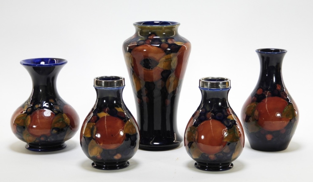 Appraisal: MOORCROFT POTTERY POMEGRANATE PATTERN VASES England th CenturyFive Moorcroft Pomegranate