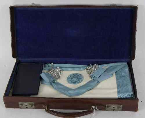 Appraisal: A Masonic apron in a leather case Cotteswold Lodge