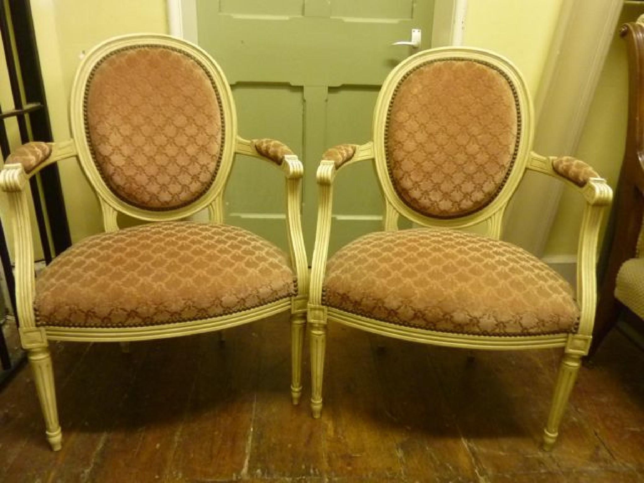 Appraisal: A pair of French style open elbow chairs with cameo