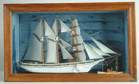 Appraisal: CARVED AND PAINTED WOOD SHIP DIORAMA Three mast ship shown