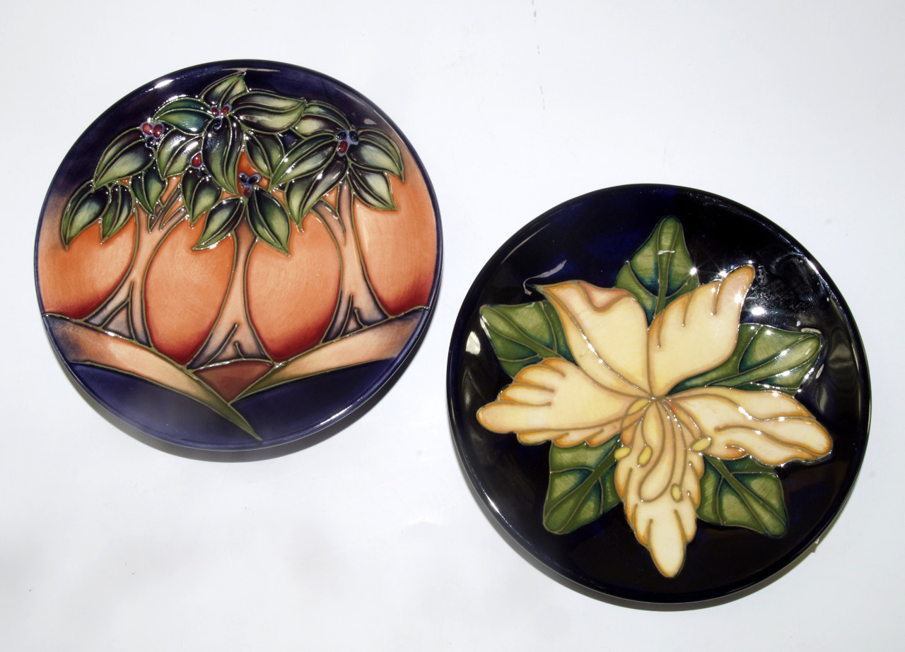 Appraisal: Two Moorcroft pottery pin dishes one decorated in the New