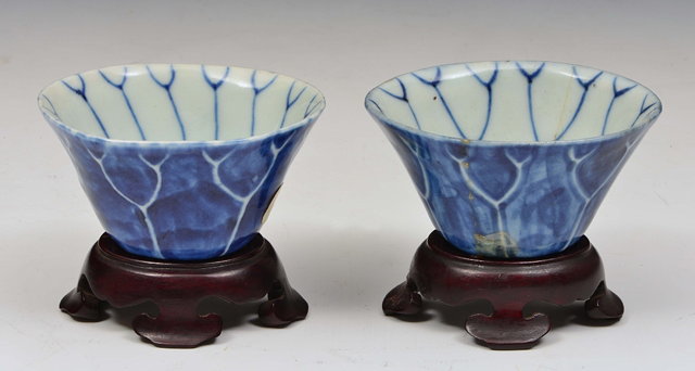 Appraisal: A PAIR OF CHINESE LOTUS LEAF CUPS the design reversed