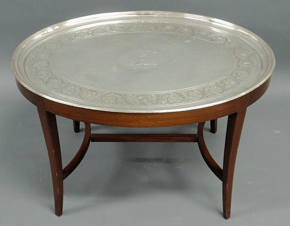 Appraisal: Oval silverplate tray top coffee table Adams style tray with