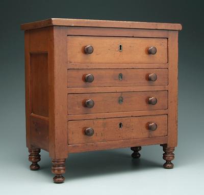 Appraisal: Cherry miniature chest of drawers four dovetailed drawers turned feet