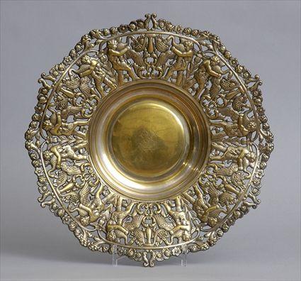 Appraisal: CONTINENTAL SILVER-ON-BRASS BASIN The monogramed bowl within pierced vinework border