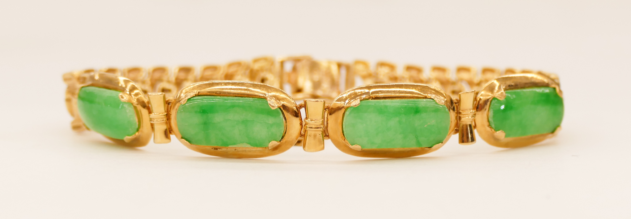 Appraisal: Chinese k Jadeite Cabochon Bracelet '' An mm thick bracelet