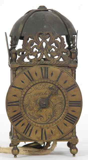 Appraisal: A brass lantern clock circa with strapwork bell top engraved