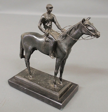 Appraisal: - Equine bronze of a jockey on a standing racehorse