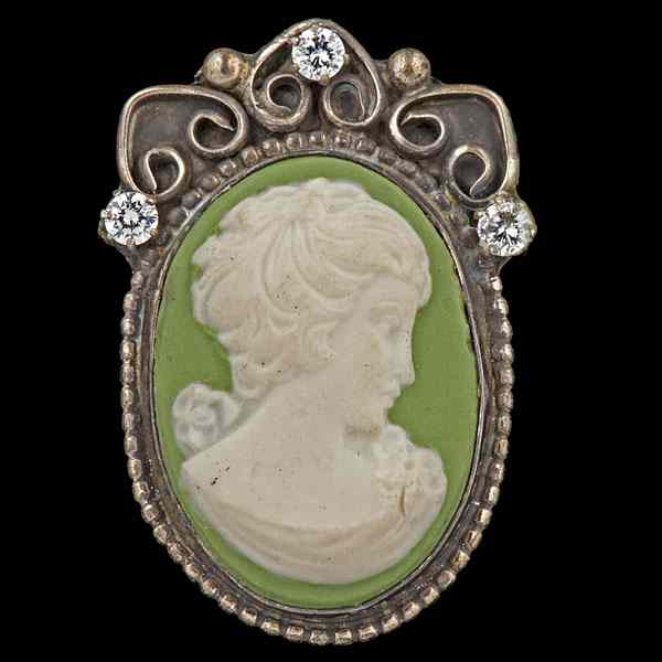 Appraisal: Green Hardstone Cameo Brooch with Diamonds A green surface cameo