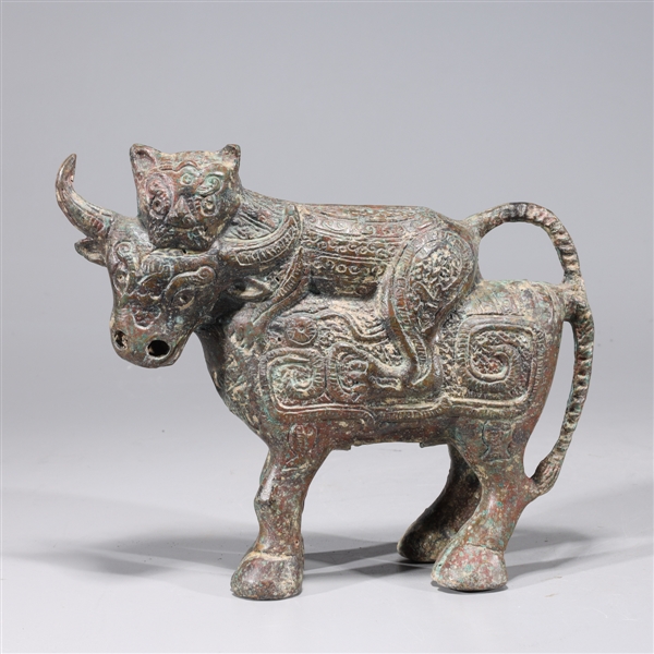 Appraisal: Chinese bronze archaistic bull and cat statue with allover molded