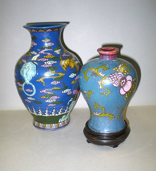 Appraisal: Two blue ground enameled porcelain vases The larger with raised