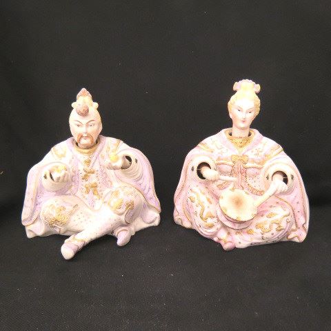 Appraisal: Pair of Bisque Porcelain Nodder Figurines seated oriental man woman