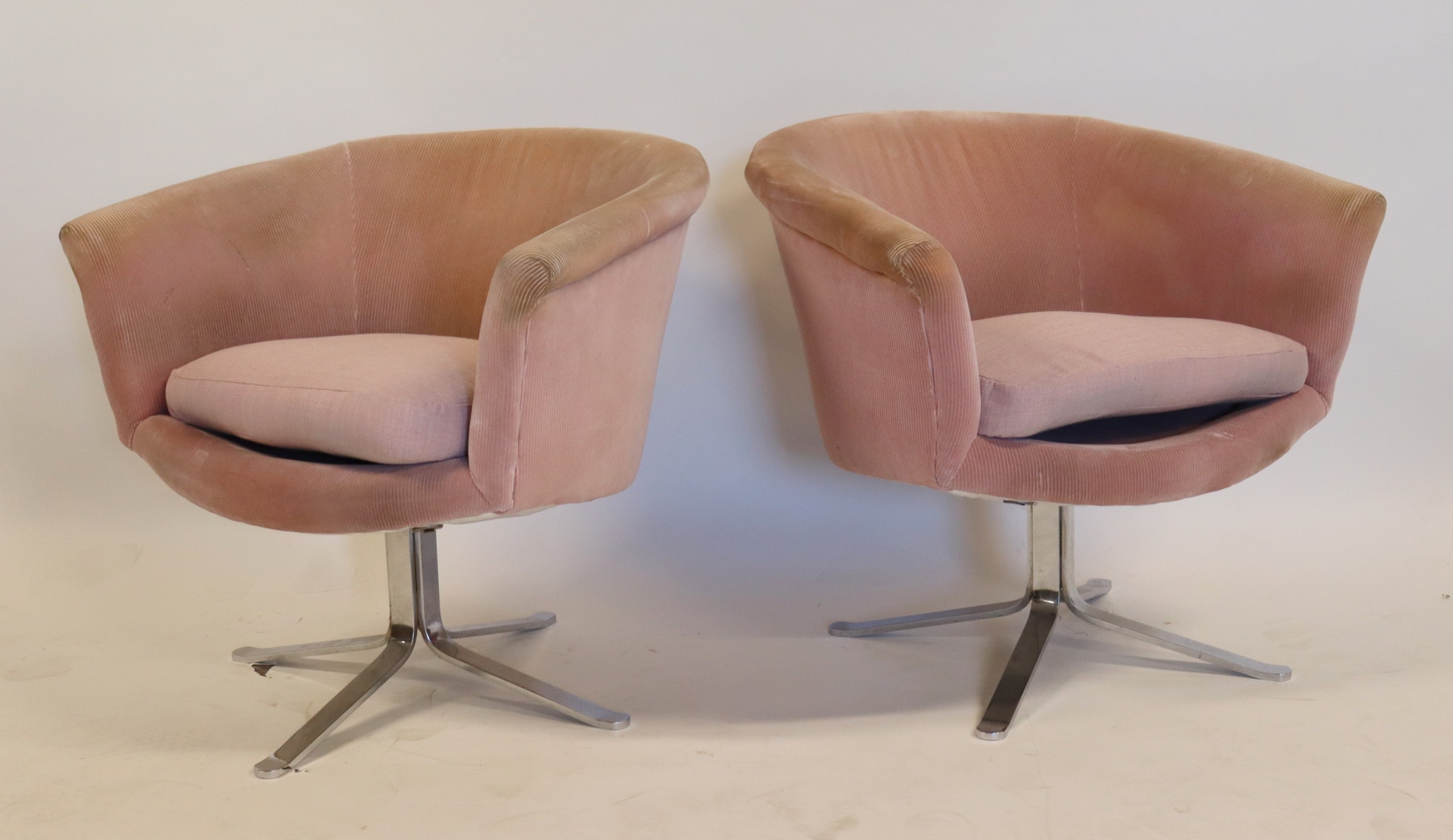 Appraisal: MIDCENTURY PAIR OF CHROME UPHOLSTERED SWIVEL Chairs In the style