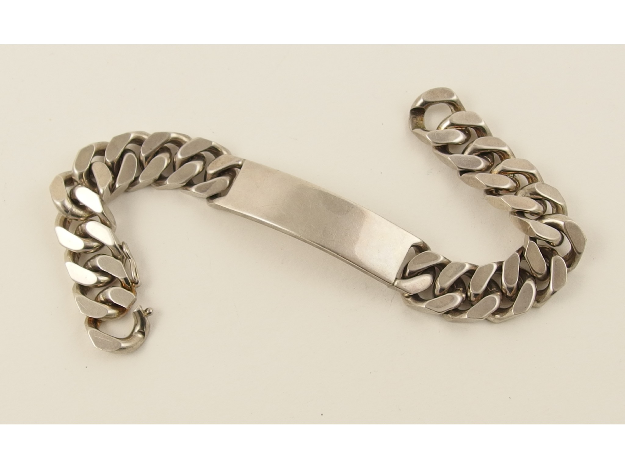 Appraisal: A heavy silver identity bracelet