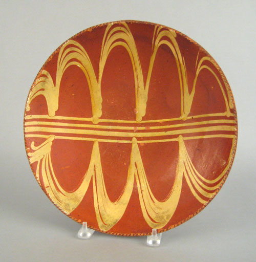 Appraisal: Southeastern Pennsylvania redware charger th c with yellow slip decoration