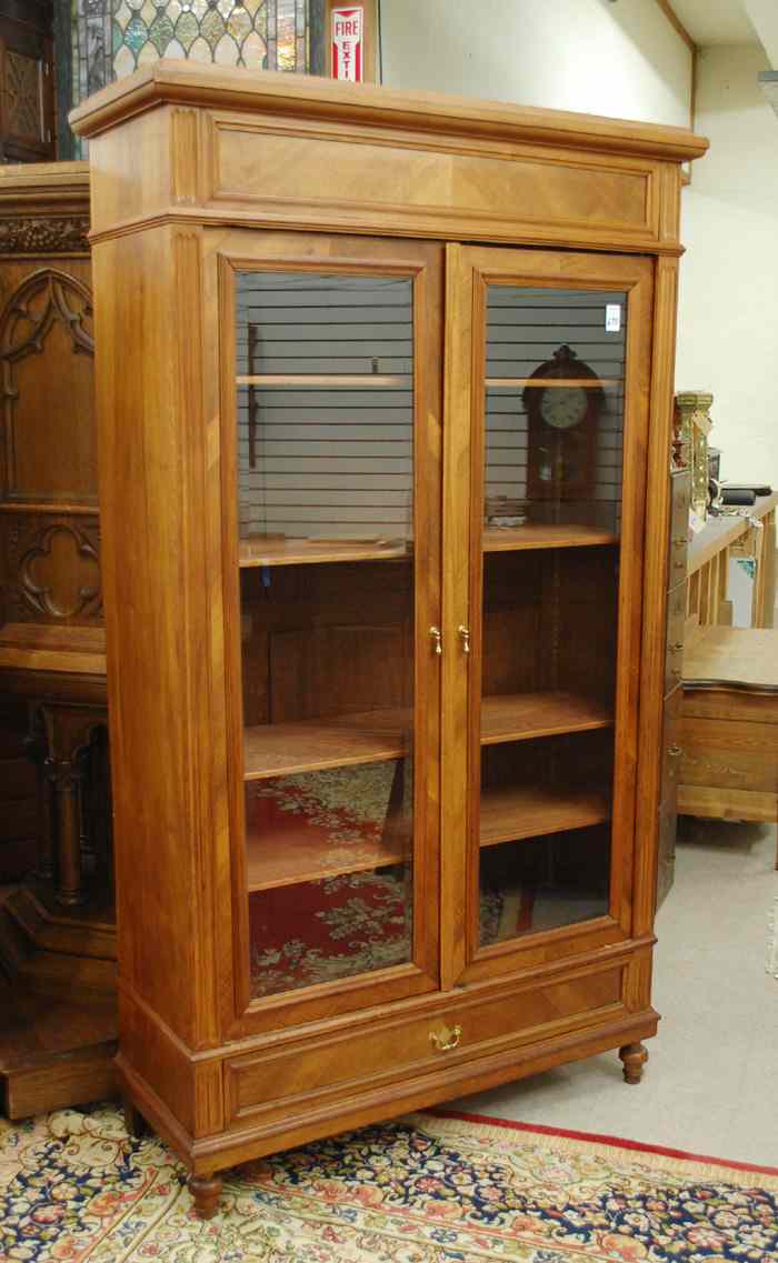 Appraisal: TWO-DOOR WALNUT CABINET BOOKCASE Continental late th century having a