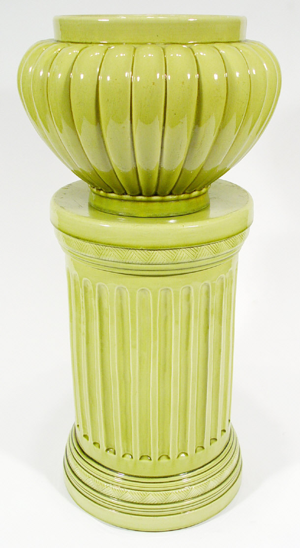 Appraisal: Burmantofts Faience green glazed pottery jardiniere on a separate fluted